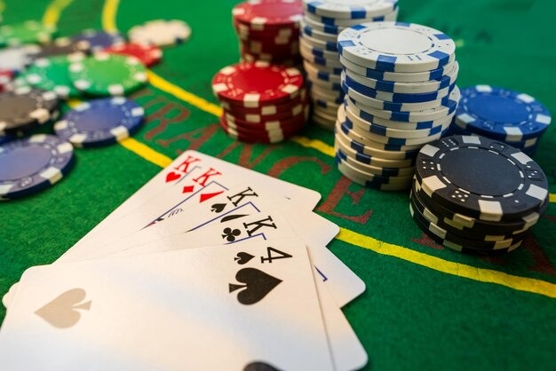 Mobile phone displaying bet77 login screen with football match odds and live-dealer game tiles